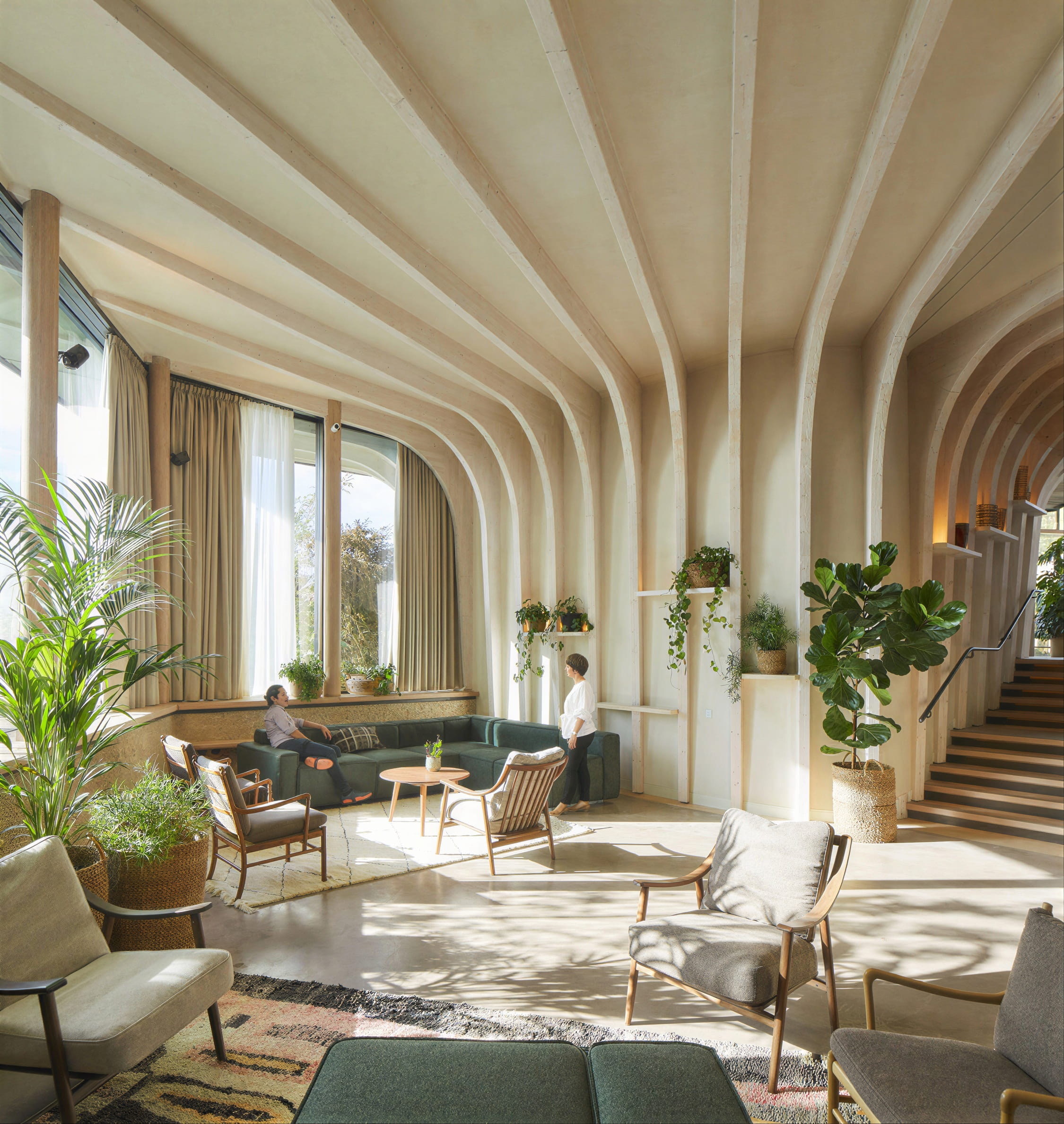Modernist interior after upscaling with sharp arch details, plants, and natural light
