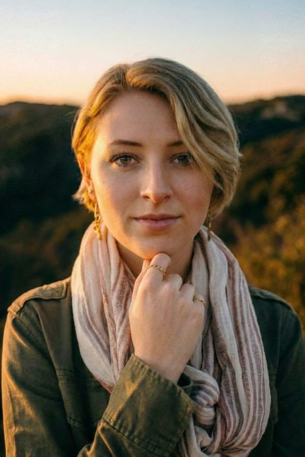 Woman with scarf in outdoor portrait before AI image upscaling